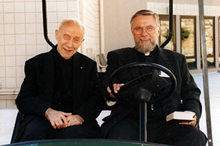 Fr. John A. Hardon in a Golf Cart